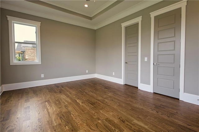 unfurnished bedroom featuring dark wood-type flooring and ornamental molding