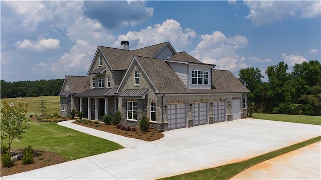 view of front of home featuring a front yard and a garage