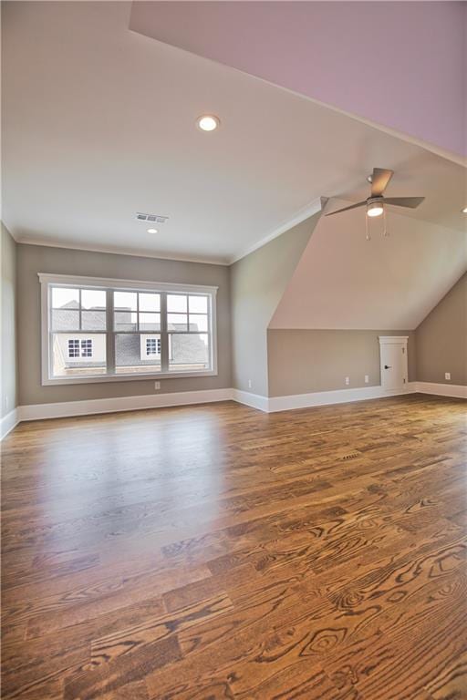 unfurnished living room featuring ceiling fan, hardwood / wood-style flooring, and lofted ceiling