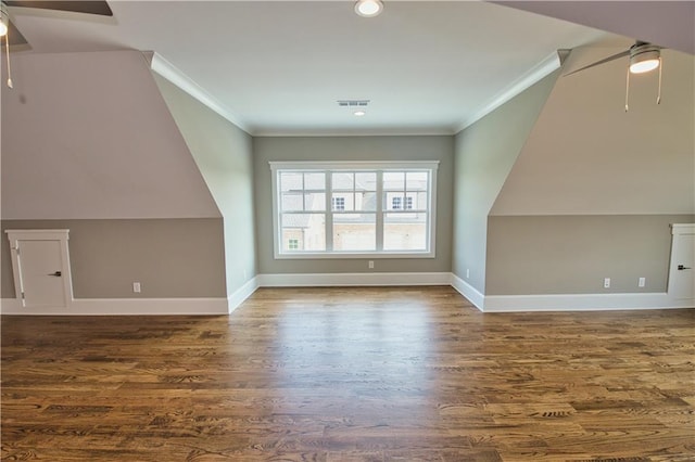 additional living space with ceiling fan, vaulted ceiling, and hardwood / wood-style flooring