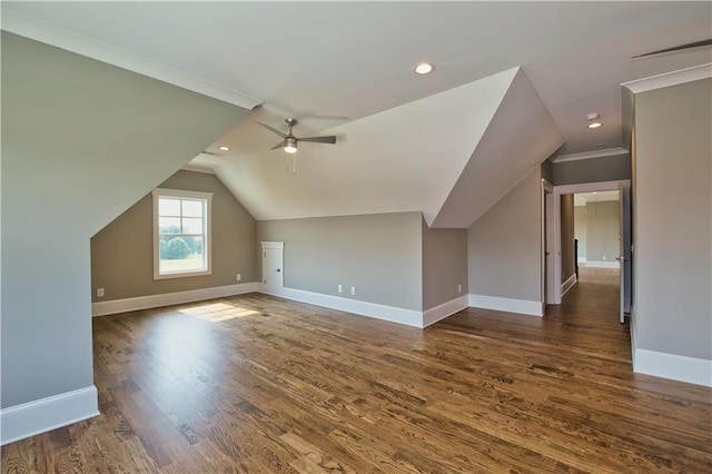 bonus room featuring ceiling fan, vaulted ceiling, and dark hardwood / wood-style flooring