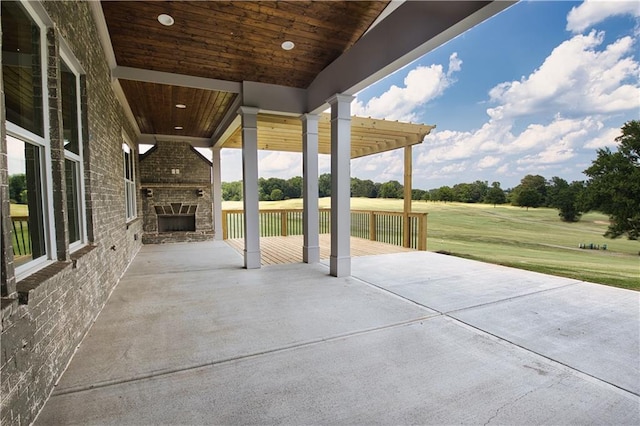 view of patio / terrace featuring a fireplace