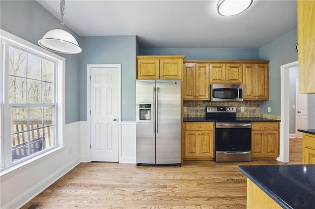 336 Toto Dr, Dawsonville, GA 30534 - kitchen featuring dark countertops, pendant lighting, stainless steel appliances, and a healthy amount of sunlight