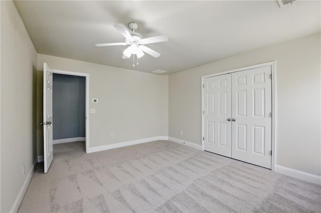 336 Toto Dr, Dawsonville, GA 30534 - unfurnished bedroom featuring a closet, baseboards, a ceiling fan, and carpet floors