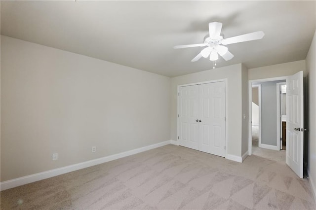 336 Toto Dr, Dawsonville, GA 30534 - unfurnished bedroom with light colored carpet, ceiling fan, a closet, and baseboards