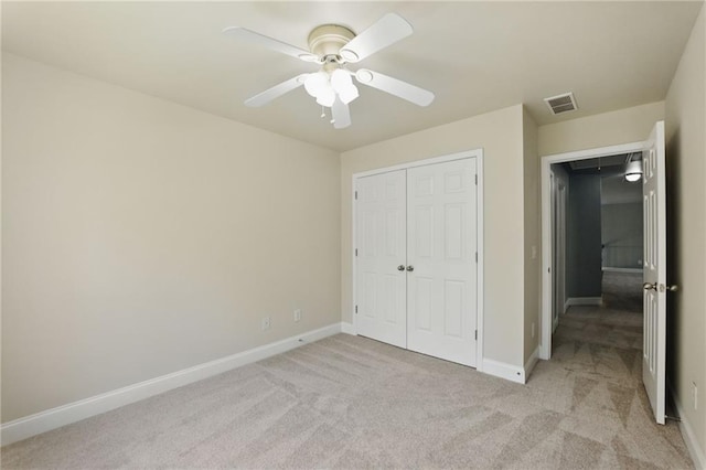 336 Toto Dr, Dawsonville, GA 30534 - unfurnished bedroom featuring visible vents, ceiling fan, a closet, baseboards, and light carpet