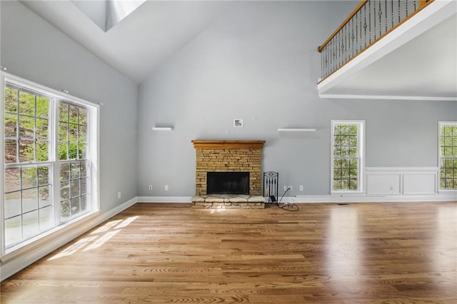 336 Toto Dr, Dawsonville, GA 30534 - unfurnished living room featuring high vaulted ceiling, wood finished floors, and a fireplace