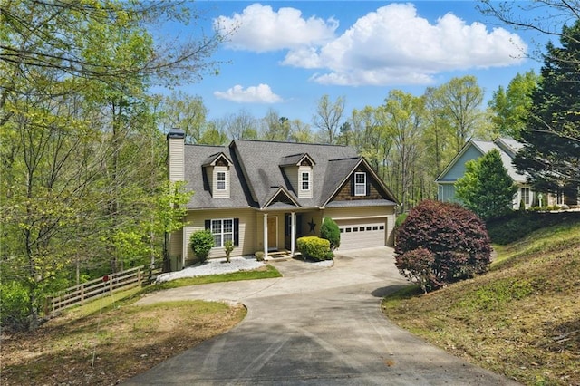 336 Toto Dr, Dawsonville, GA 30534 - cape cod house featuring a chimney, fence, driveway, and a garage