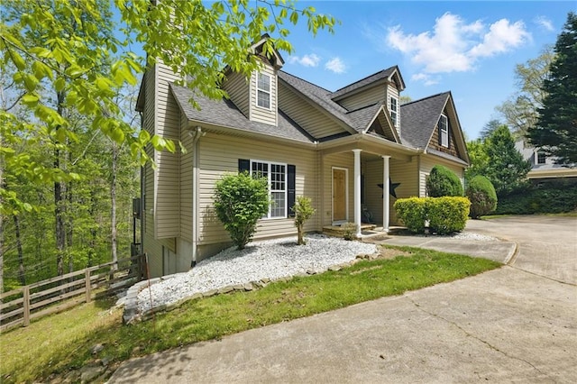 336 Toto Dr, Dawsonville, GA 30534 - view of front of home with fence, roof with shingles, and a chimney