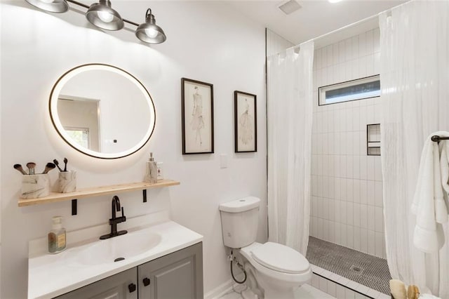 bathroom featuring vanity, toilet, and a shower with shower curtain