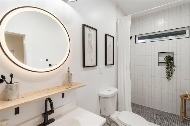 bathroom with vanity, curtained shower, and toilet