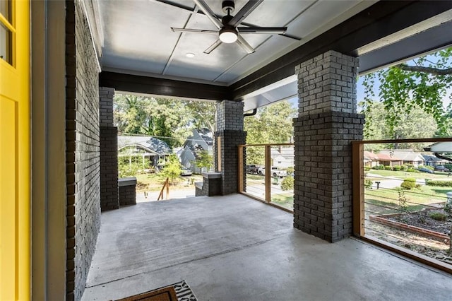 doorway to outside with concrete floors and ceiling fan