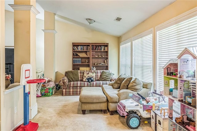 2606 Fairmont Park Ct, Dacula, GA 30019 - living area with lofted ceiling, carpet, ornate columns, and visible vents