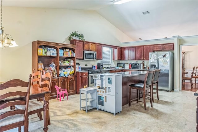 2606 Fairmont Park Ct, Dacula, GA 30019 - kitchen featuring pendant lighting, a breakfast bar area, a center island, an inviting chandelier, and appliances with stainless steel finishes