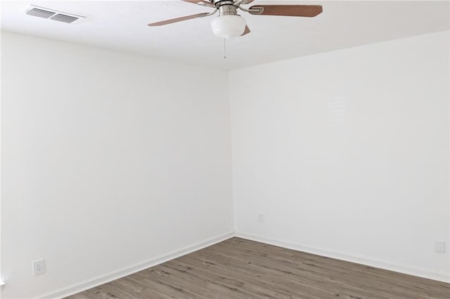 empty room with dark hardwood / wood-style floors