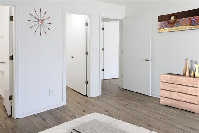 bedroom with light hardwood / wood-style floors