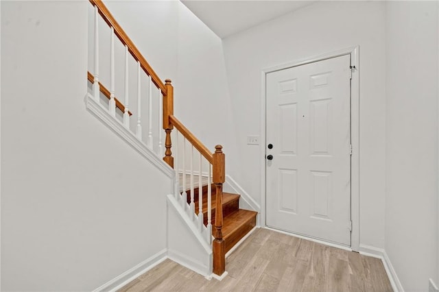 foyer entrance with light hardwood / wood-style flooring