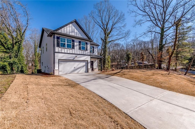 view of front of property featuring a garage and a front lawn