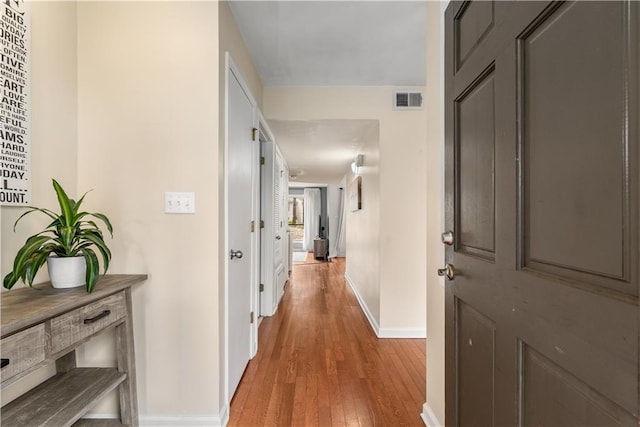 hallway featuring light wood-type flooring