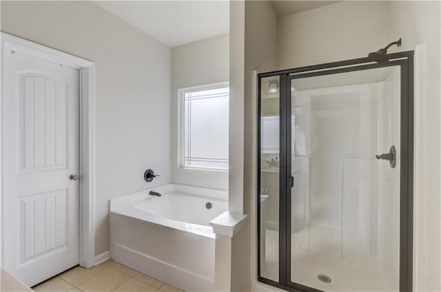 bathroom featuring separate shower and tub and tile patterned floors