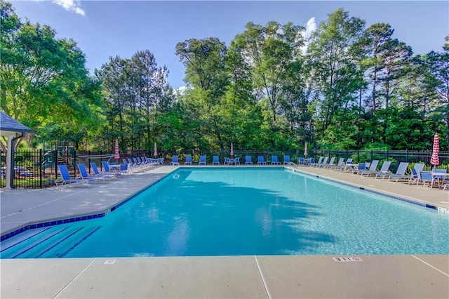 view of swimming pool featuring a patio