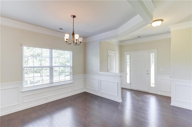 interior space with a chandelier, crown molding, and dark hardwood / wood-style floors