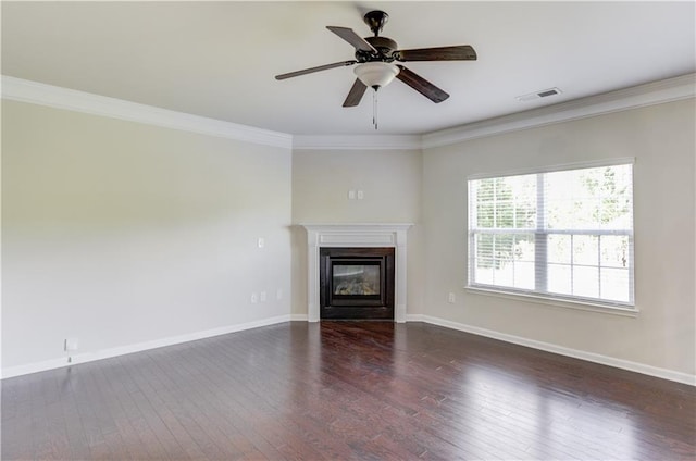 unfurnished living room featuring ceiling fan, crown molding, and dark hardwood / wood-style flooring