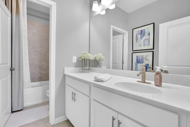 bathroom with shower / tub combo, vanity, toilet, and tile patterned floors