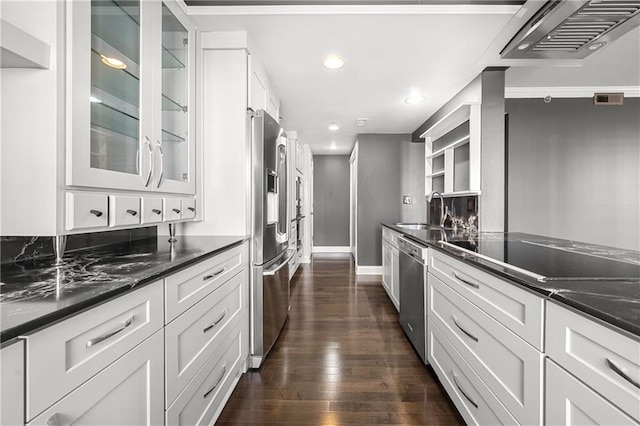 kitchen with white cabinetry, sink, range hood, and appliances with stainless steel finishes