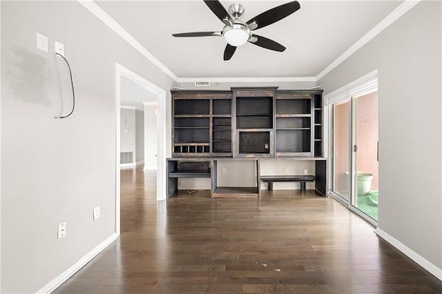 unfurnished office featuring dark wood-type flooring, ceiling fan, and ornamental molding