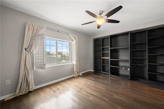 unfurnished bedroom with ceiling fan and dark hardwood / wood-style floors