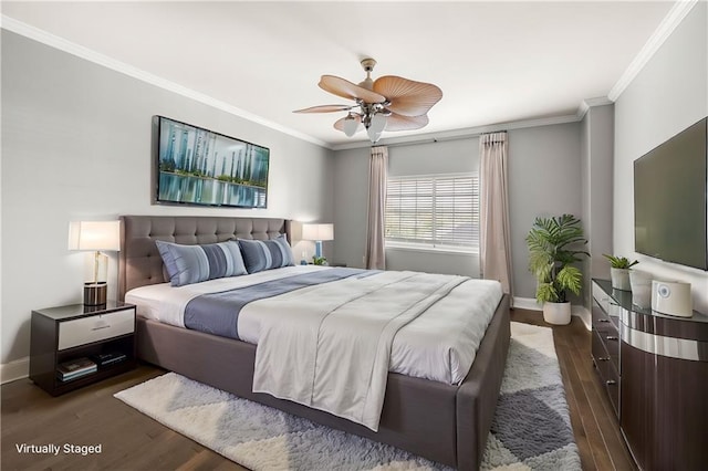 bedroom featuring ceiling fan, dark hardwood / wood-style flooring, and ornamental molding