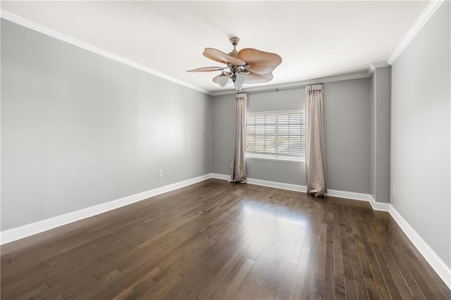 spare room featuring dark hardwood / wood-style flooring, ceiling fan, and ornamental molding