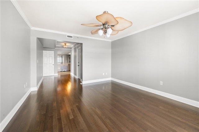 unfurnished room featuring ceiling fan, crown molding, and dark wood-type flooring