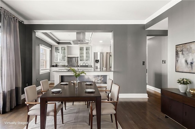 dining area featuring dark hardwood / wood-style flooring and ornamental molding