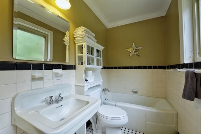 bathroom featuring tile walls, toilet, a bath, and tile floors