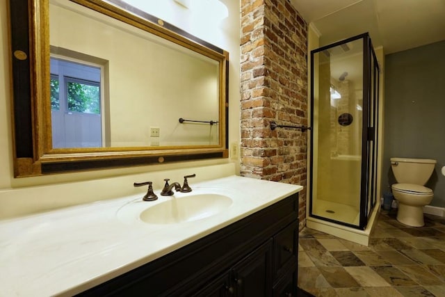 bathroom with tile floors, toilet, large vanity, and walk in shower