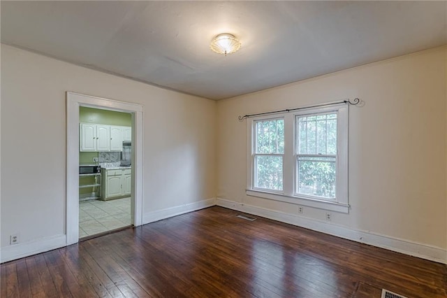 empty room featuring hardwood / wood-style flooring