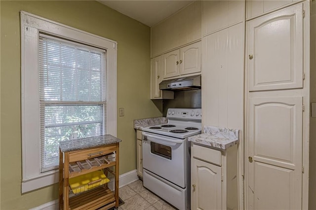 kitchen featuring white cabinetry, white electric range, and light tile patterned flooring