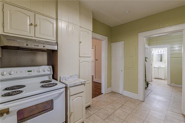 kitchen featuring white range with electric stovetop