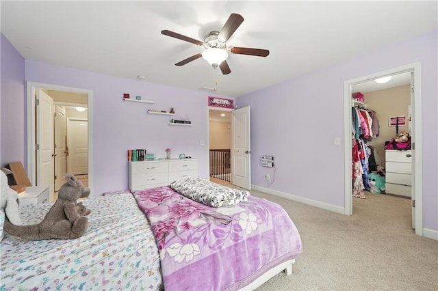 915 Elmsbrook Ln, Alpharetta, GA 30004 - bedroom with a walk in closet, light colored carpet, a closet, and ceiling fan