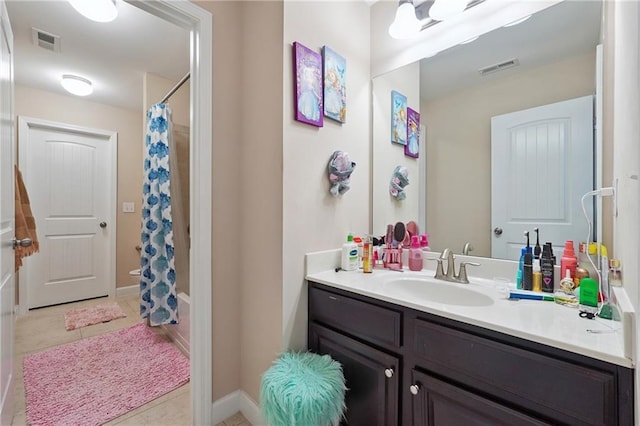 915 Elmsbrook Ln, Alpharetta, GA 30004 - bathroom featuring vanity, tile patterned flooring, and shower / bath combination with curtain