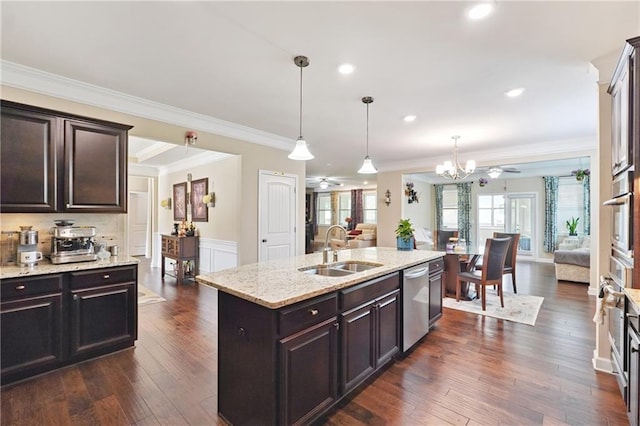 915 Elmsbrook Ln, Alpharetta, GA 30004 - kitchen with open floor plan, appliances with stainless steel finishes, a chandelier, light stone countertops, and crown molding