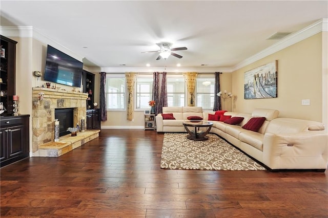 915 Elmsbrook Ln, Alpharetta, GA 30004 - living area featuring a ceiling fan, ornamental molding, hardwood / wood-style floors, healthy amount of natural light, and a stone fireplace