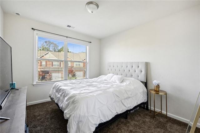 bedroom featuring baseboards, visible vents, and carpet flooring