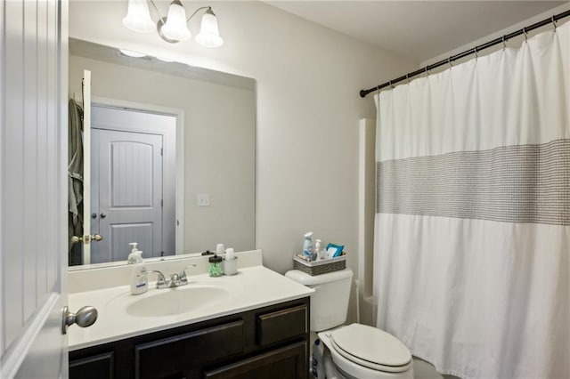 bathroom with toilet, shower / tub combo with curtain, and vanity