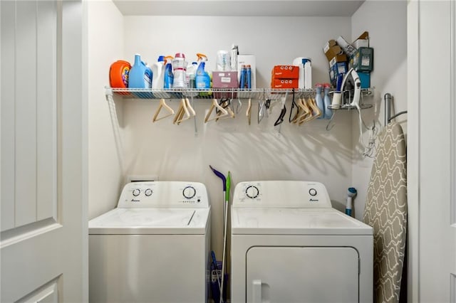 washroom featuring washing machine and dryer and laundry area