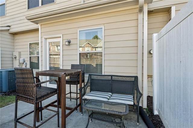 view of patio / terrace with central AC unit and outdoor dining space