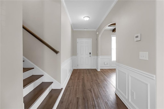 entrance foyer featuring crown molding and dark hardwood / wood-style floors