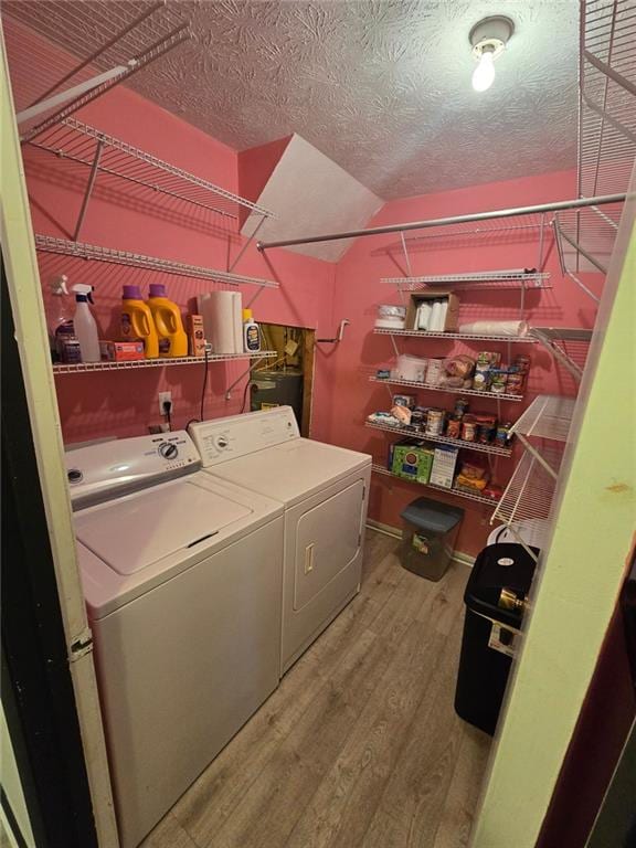 1297 Tree Creek Ct, Clarkston, GA 30021 - laundry area with washer and dryer and wood finished floors